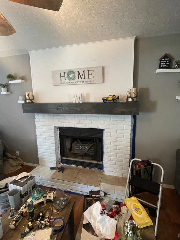 Renovated fireplace with new mantel and paint